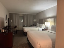 View entering a bedroom with two Queen beds