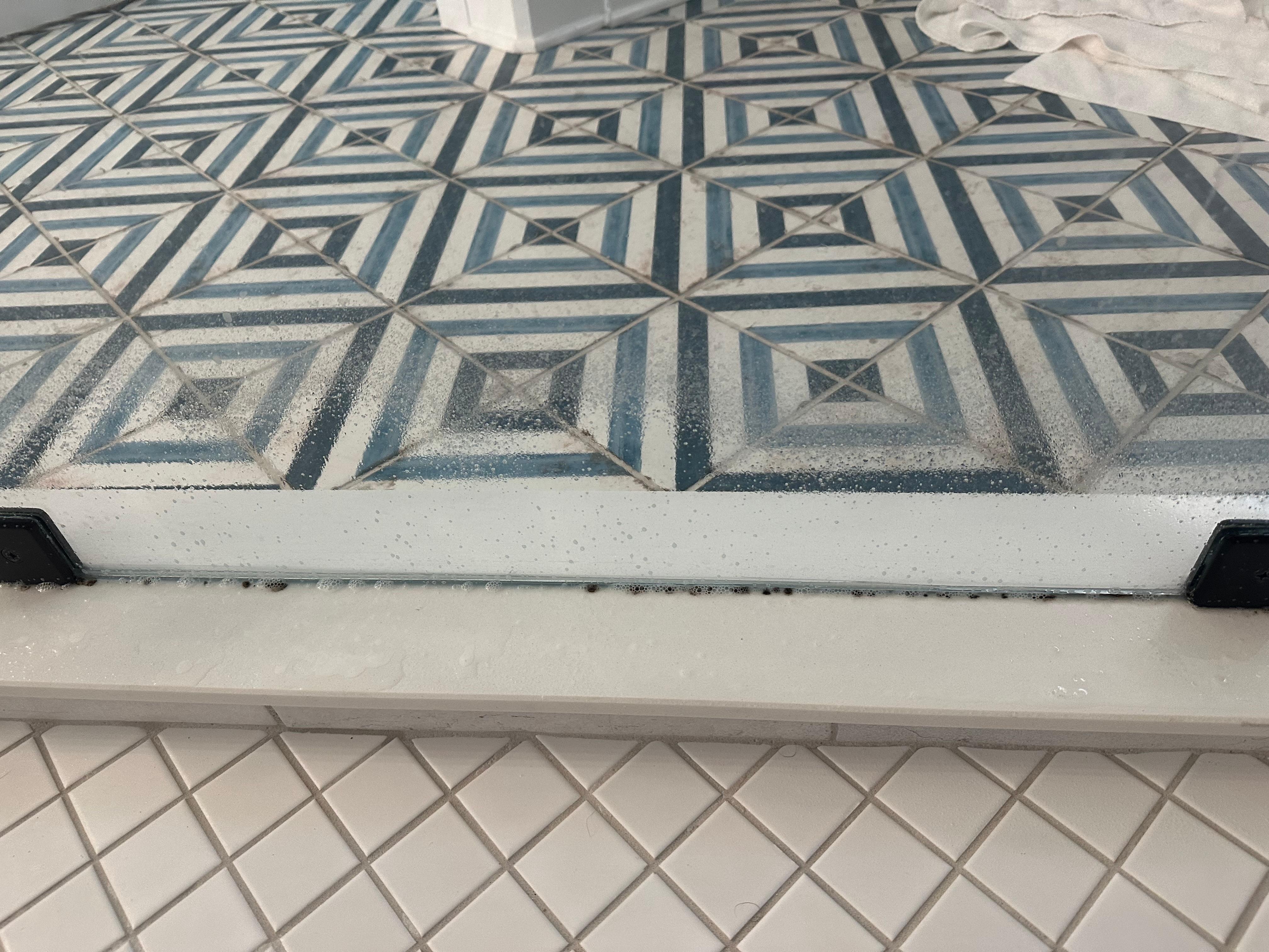 Mold all the way around the shower upstairs 