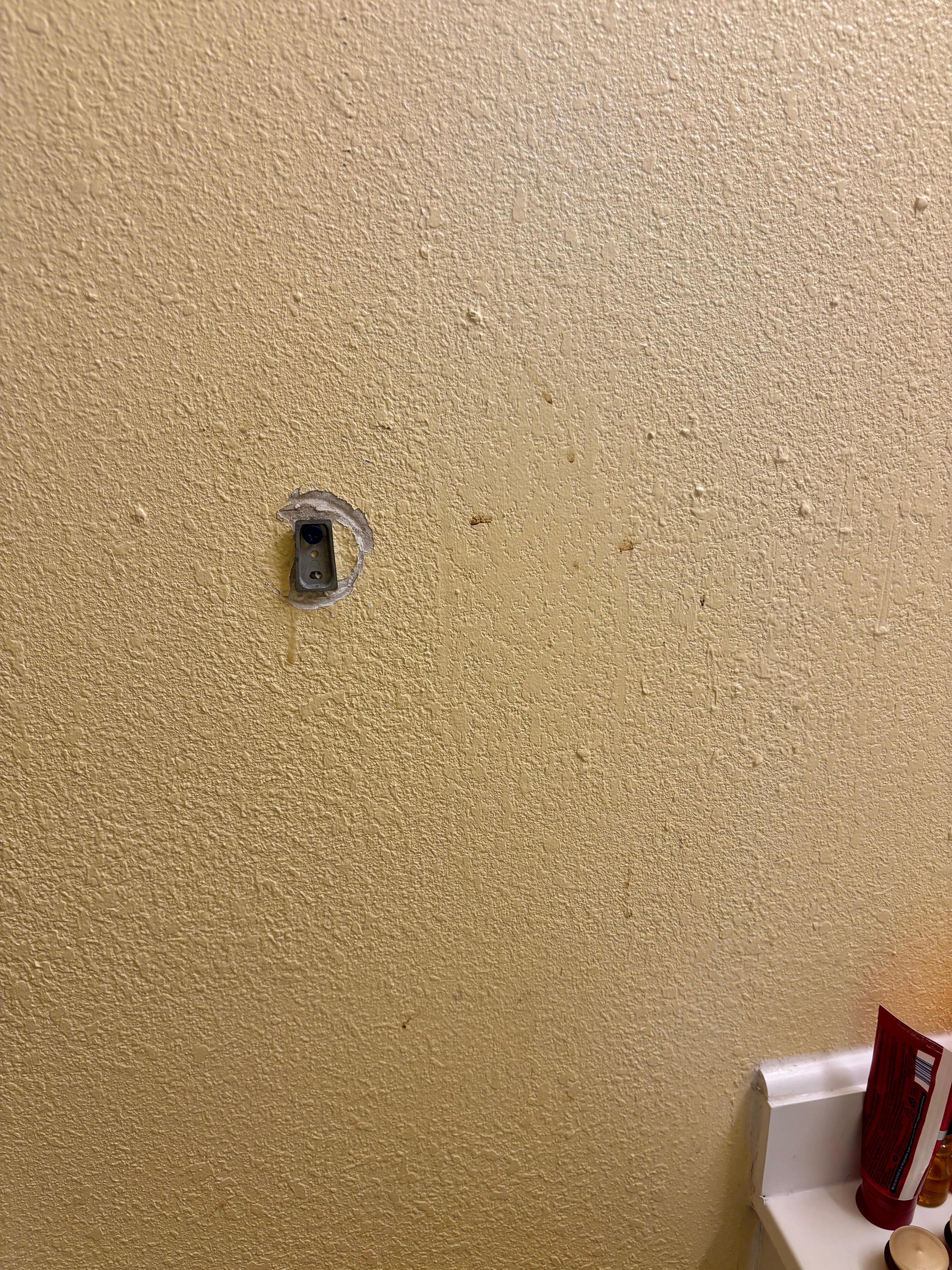 Bathroom wall looked like there was blood on it, 2 of the 3 towel holders were also broken.