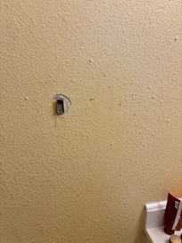 Bathroom wall looked like there was blood on it, 2 of the 3 towel holders were also broken.