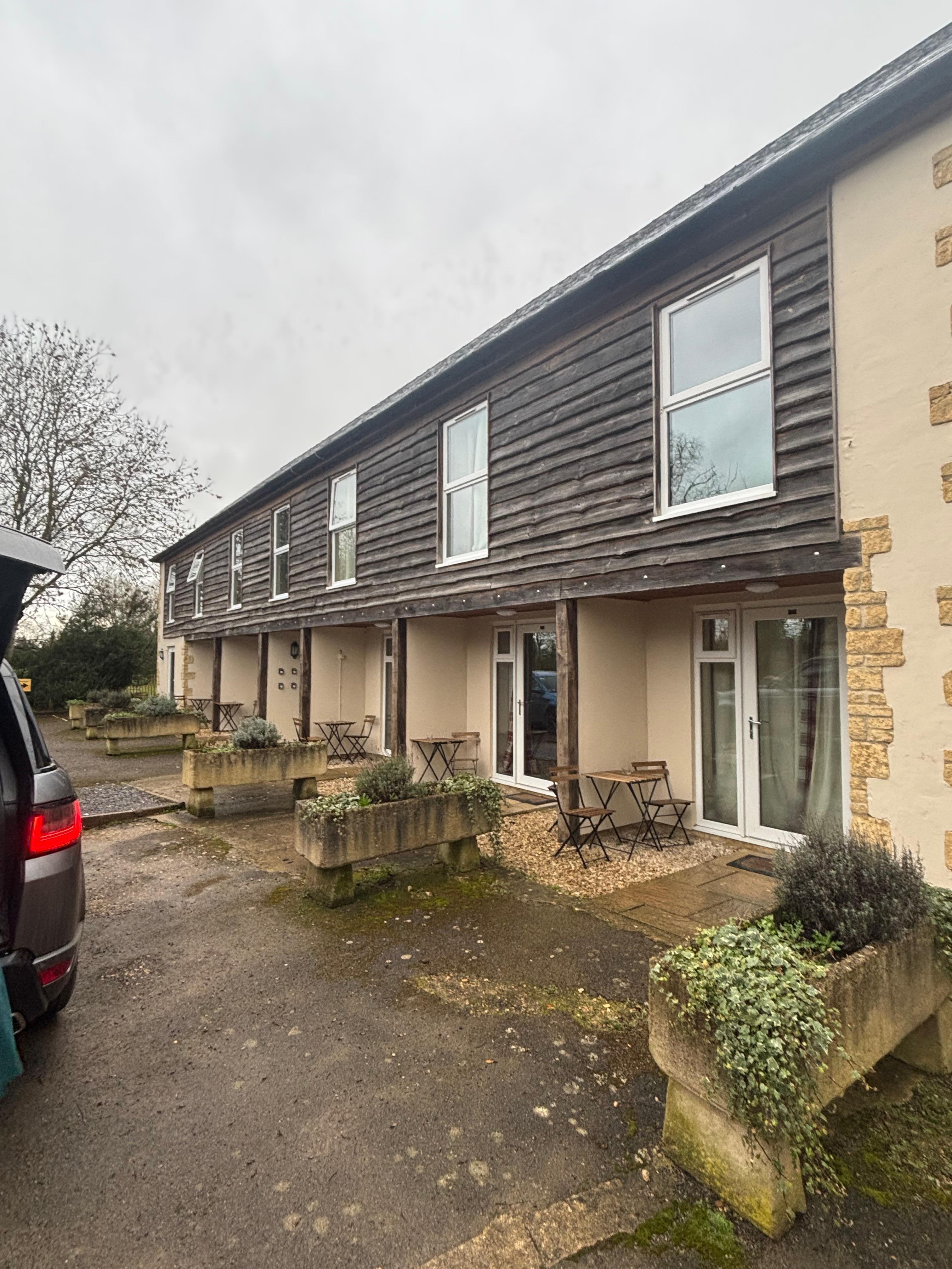 One tiny room with bed next to door