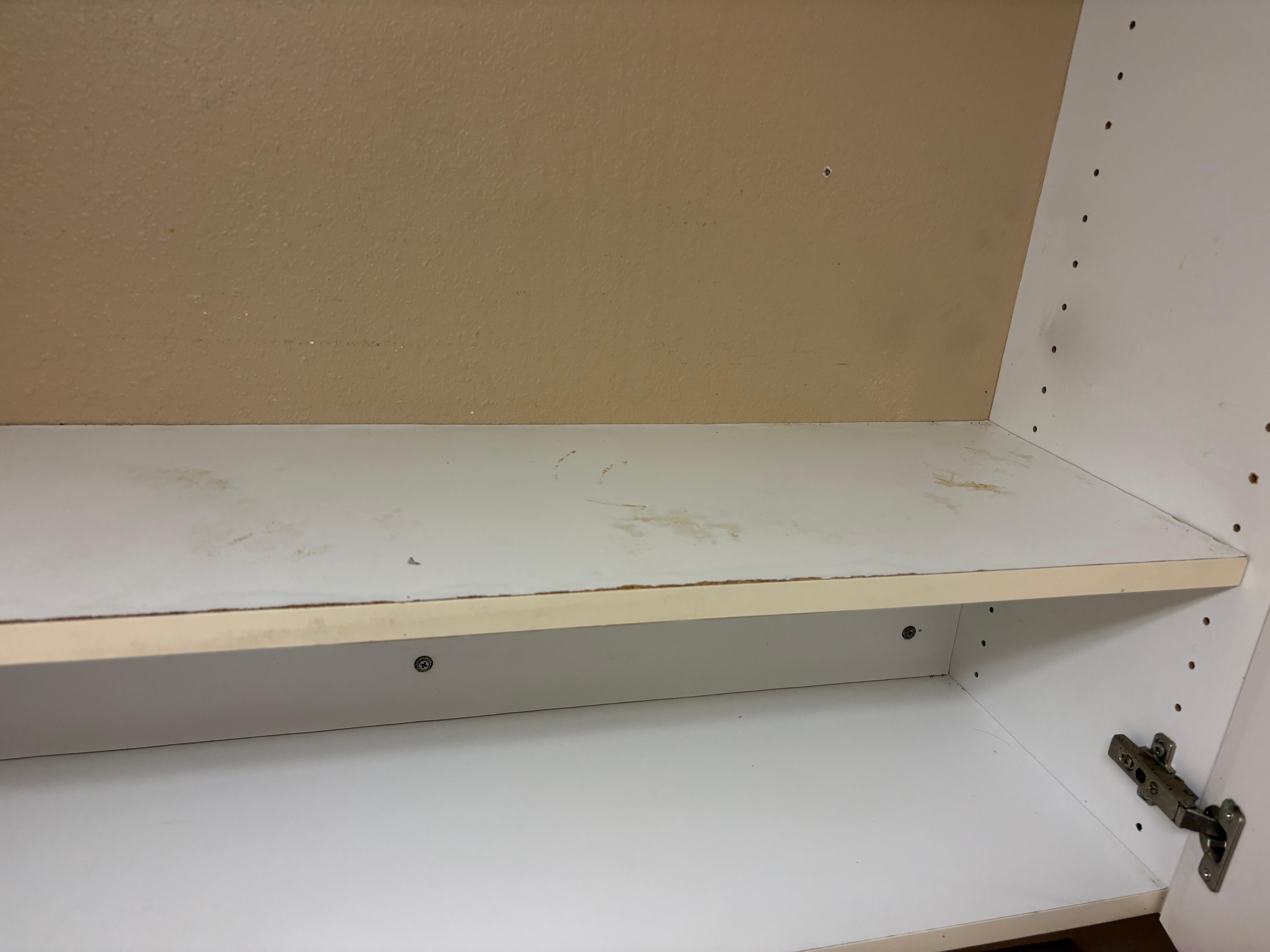 The cabinet I was supposed to put my dishes in. 