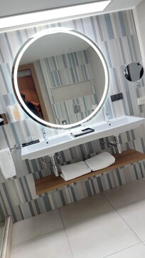 Spacious modern bathroom. Love the quietness of the toilet, no drip sounds and quick flush) Nice water flow in the shower although I did wish there was more of a tilt to the showerhead.