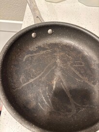Pan: food particles and Teflon peeling away.