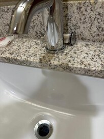 Sink stopper laying on counter