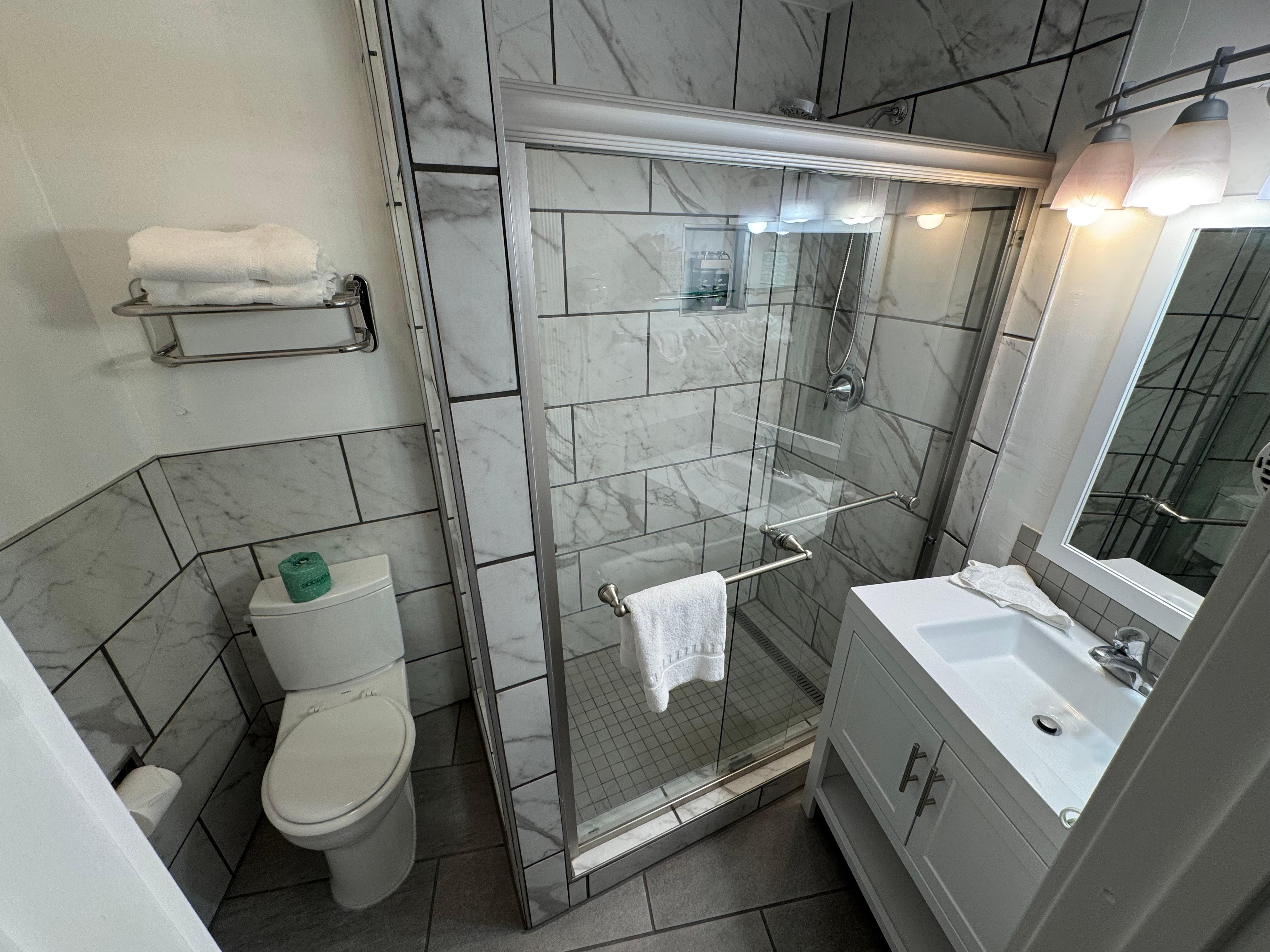 Clean bathroom with Swing door 