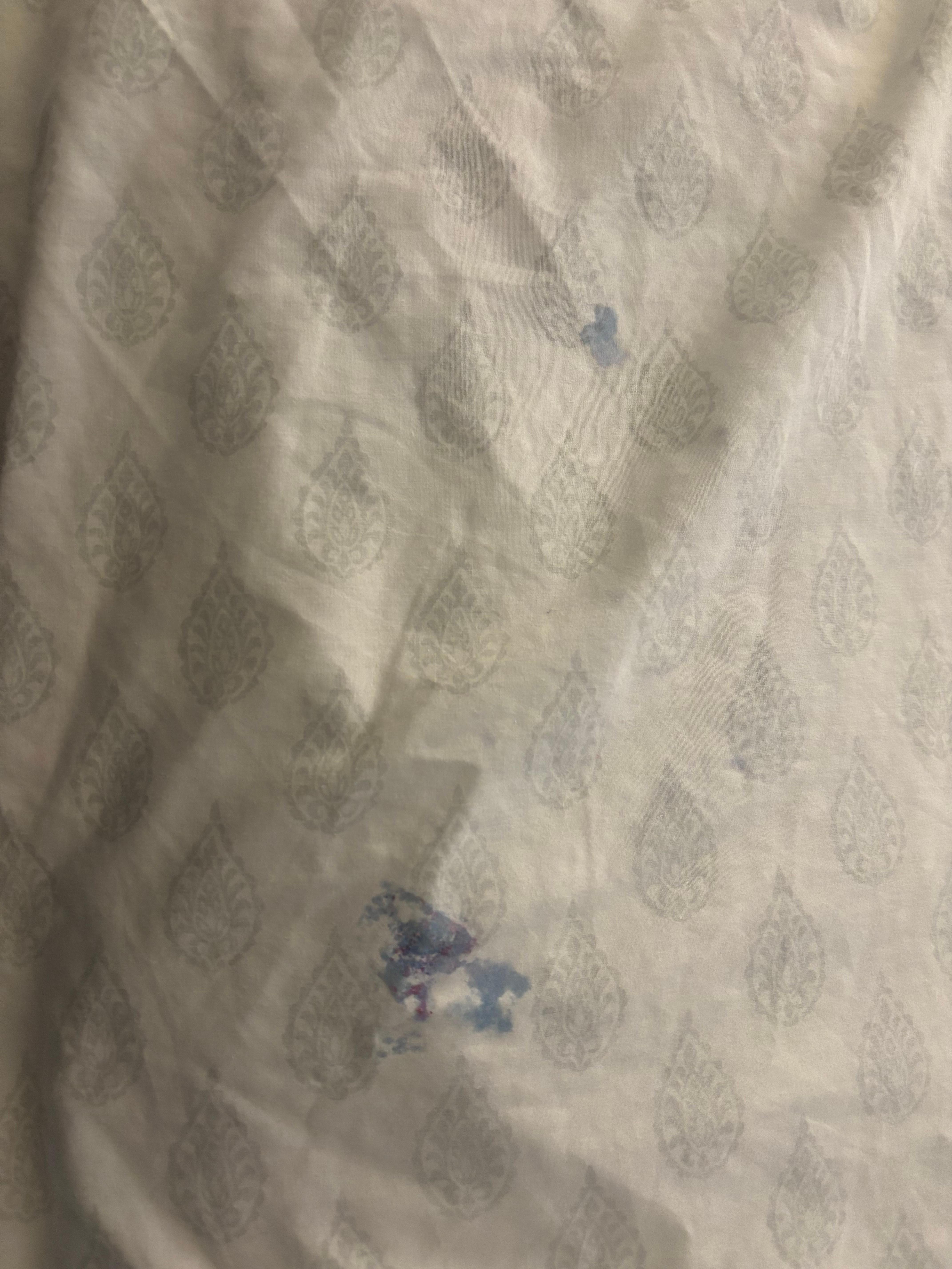 Filthy sheets that were left on the bed. 