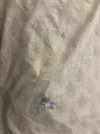 Filthy sheets that were left on the bed.