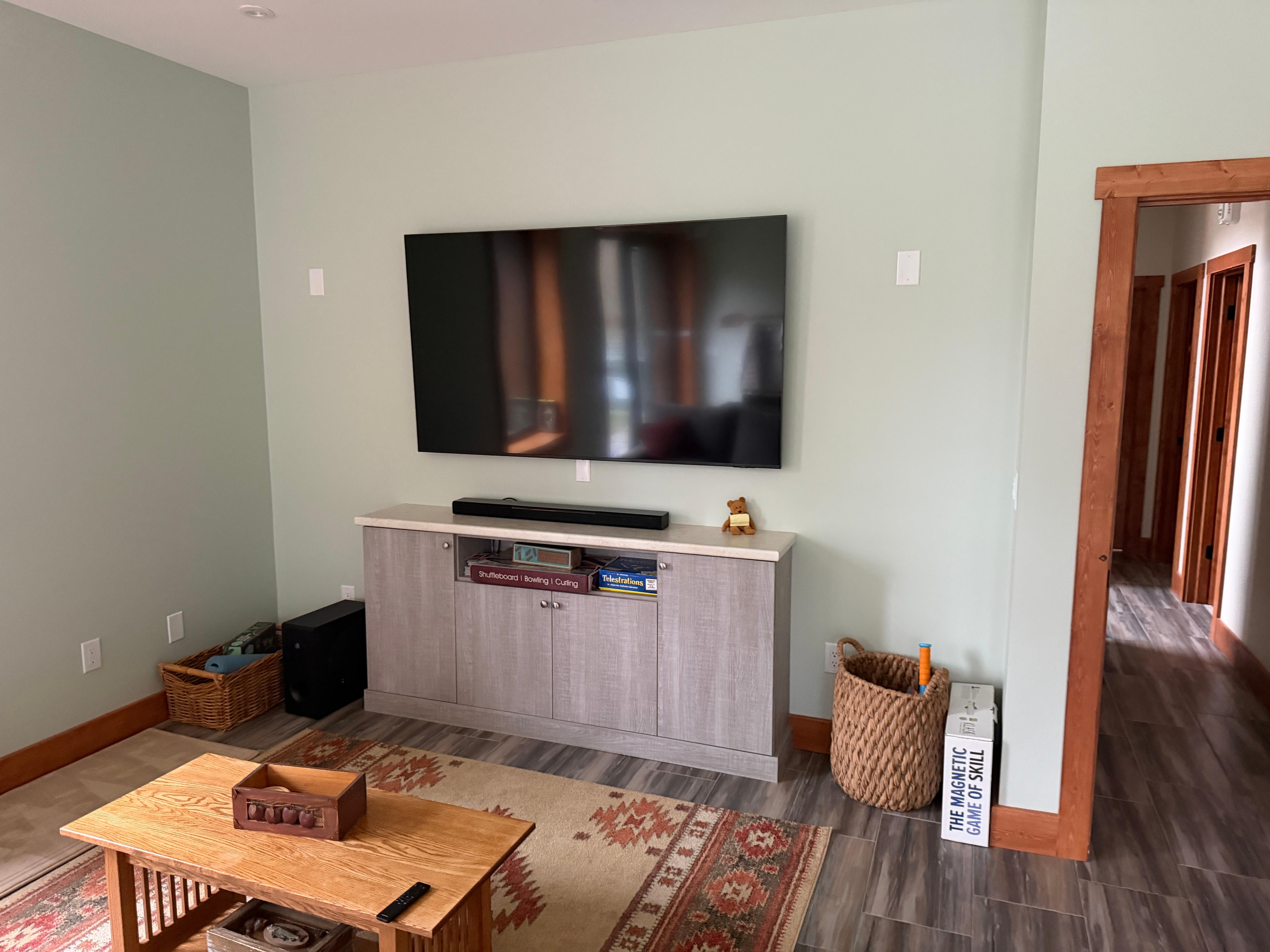 Large tv in cozy room on lower level