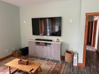 Large tv in cozy room on lower level