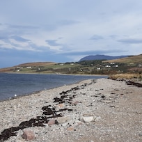 Walk along the shore down by the motor-home, caravan and camping park.