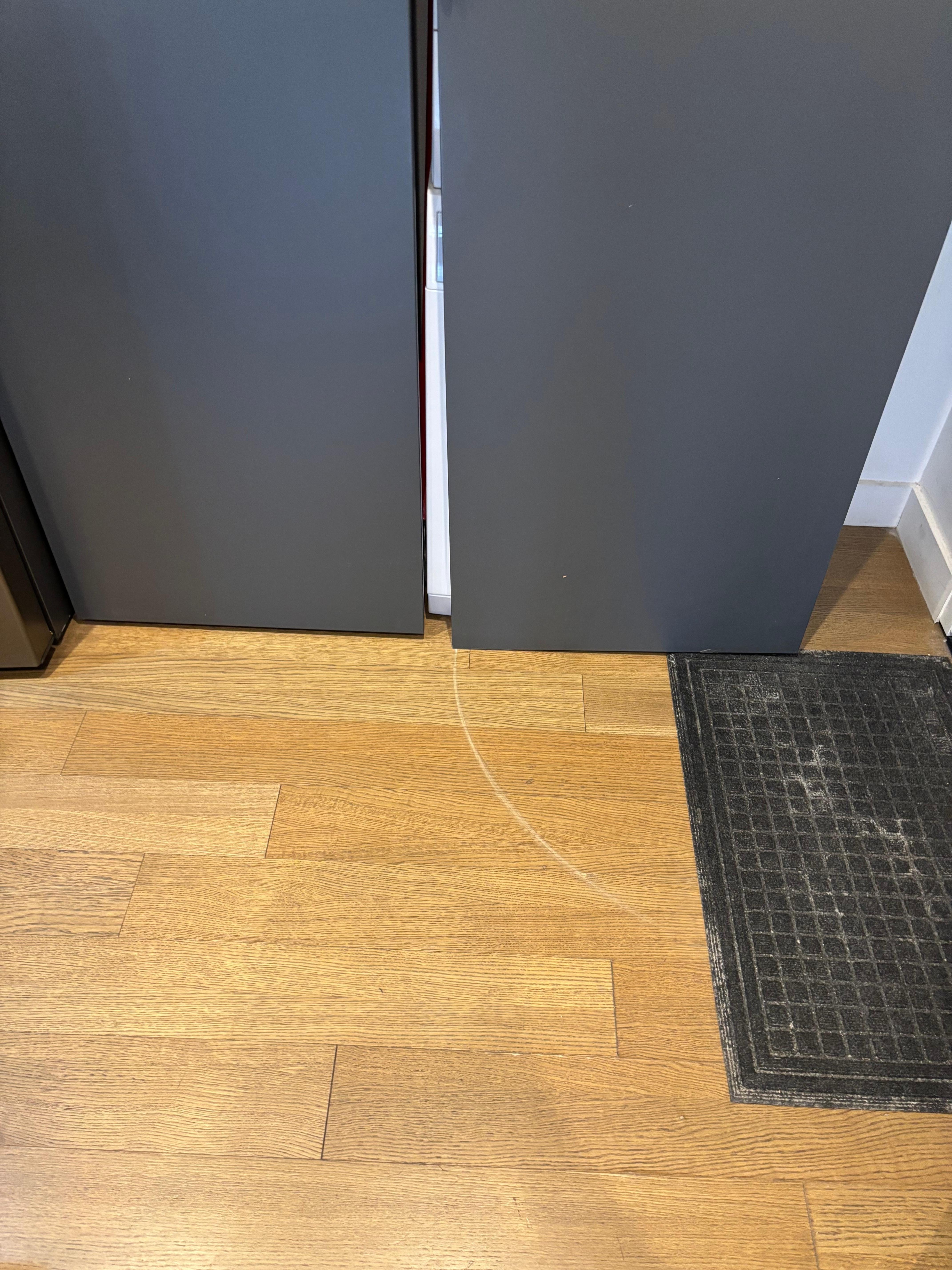 Scraped floor from door