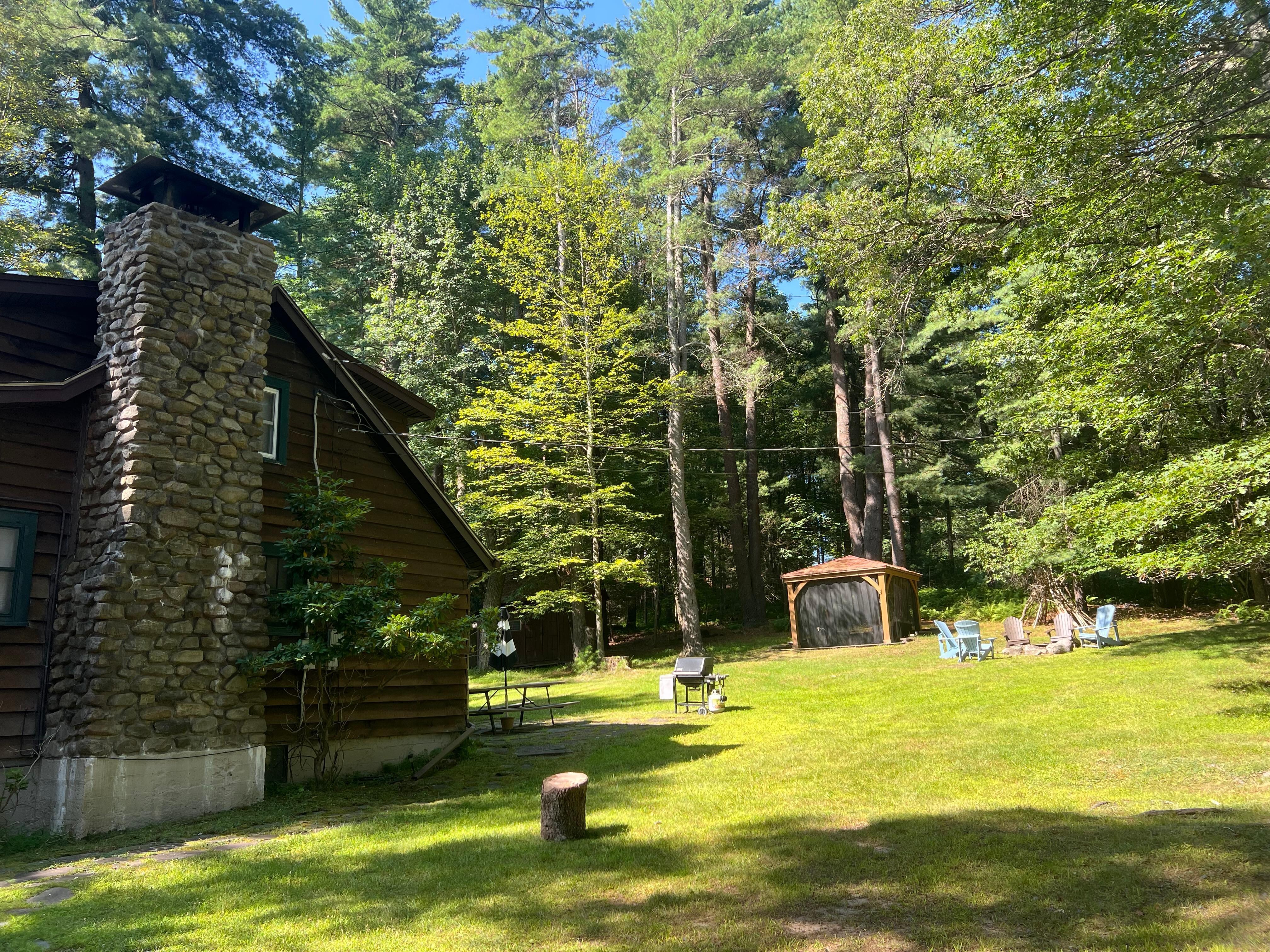 Firepit with Adirondack Chairs, Screened Patio - But no bugs when we were there.