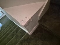 The taped area at top of stairs