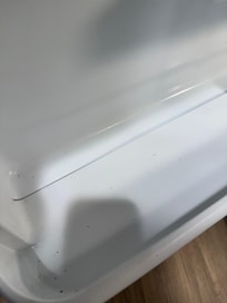 The refrigerator is full of dirt and little bugs.
