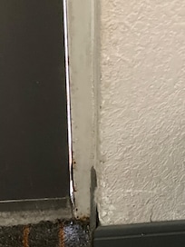 Gab near bottom of door.