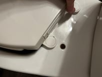 Toilet seat only attached on one side