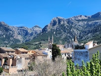 Room with view of mountains and old town