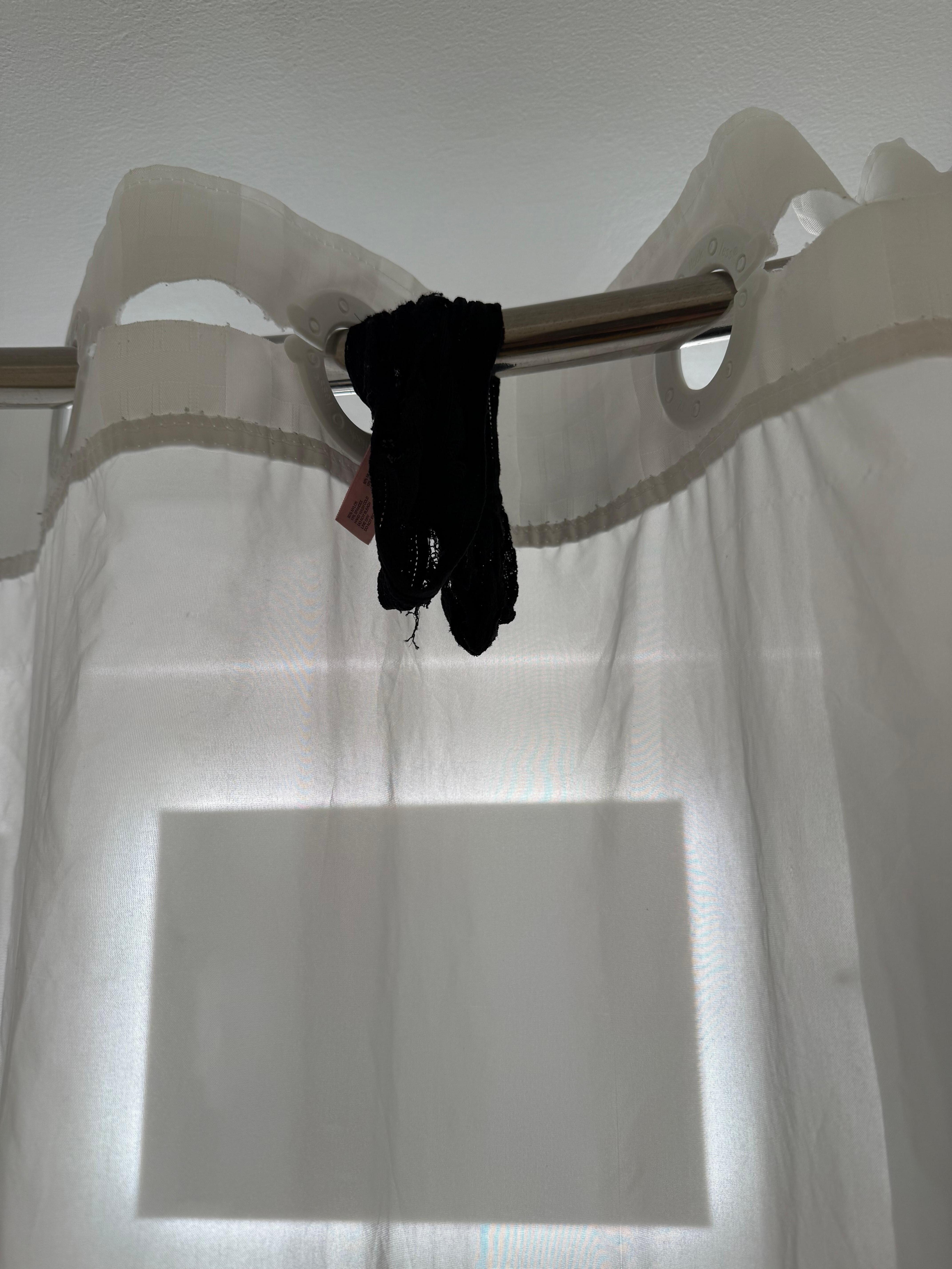 Panties hanging in the shower