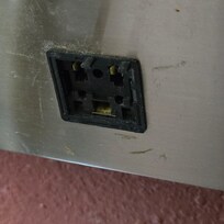 Broken outlets next to bed