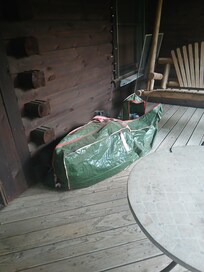 Christmas tree bag on deck and window screen not installed