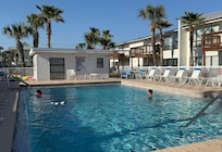 A pool included with Tennis courts on other side