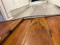 Flooring issues and the filth all over the house- look under the cabinets the entire homes baseboards looked this way. DISGUSTING