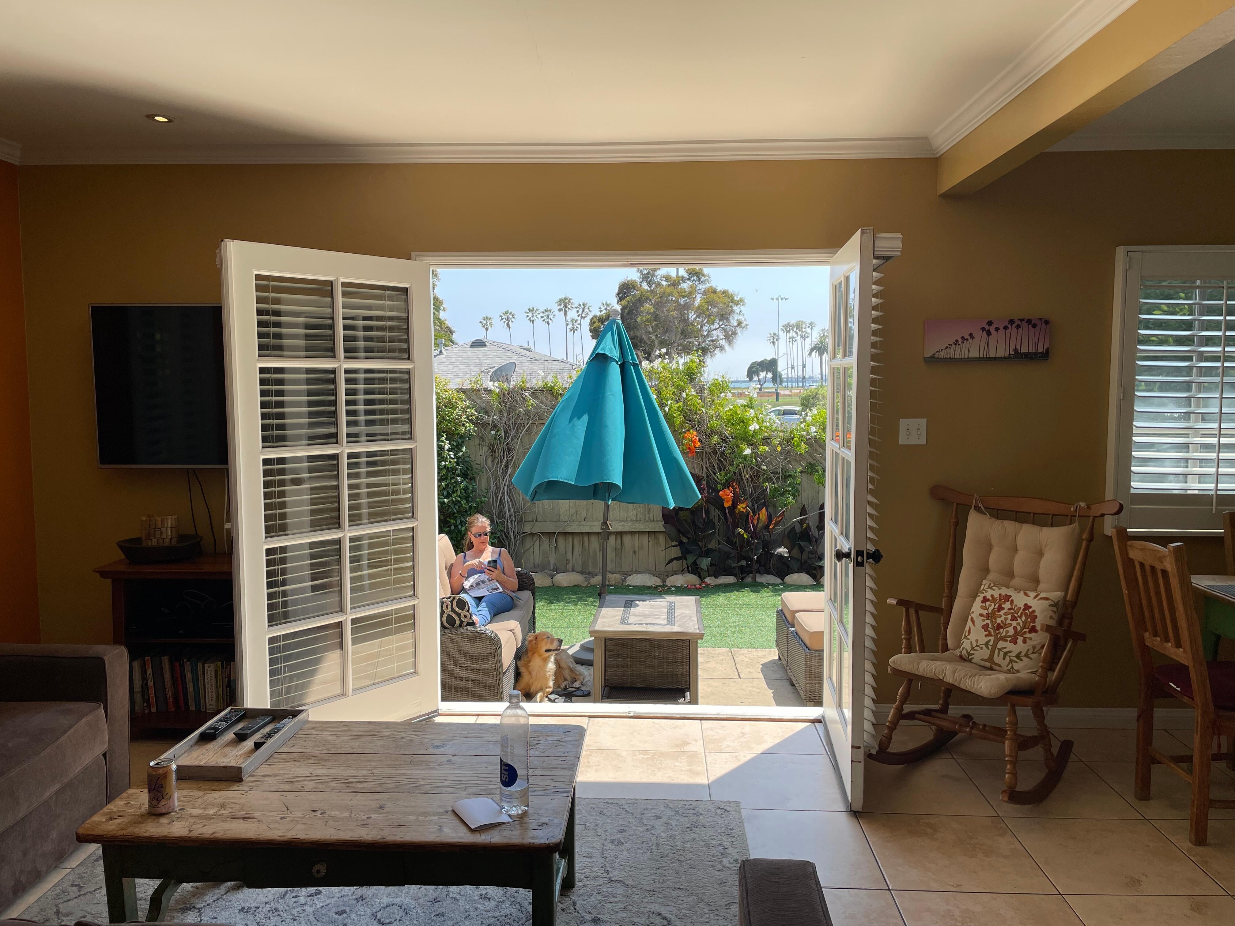 View out the back french doors with a partial view of the ocean.