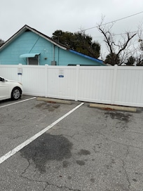 Showing the wall where you park your car and see the home on the other side.