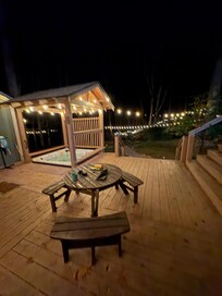 Hot tub and nightly view out to the fire pit