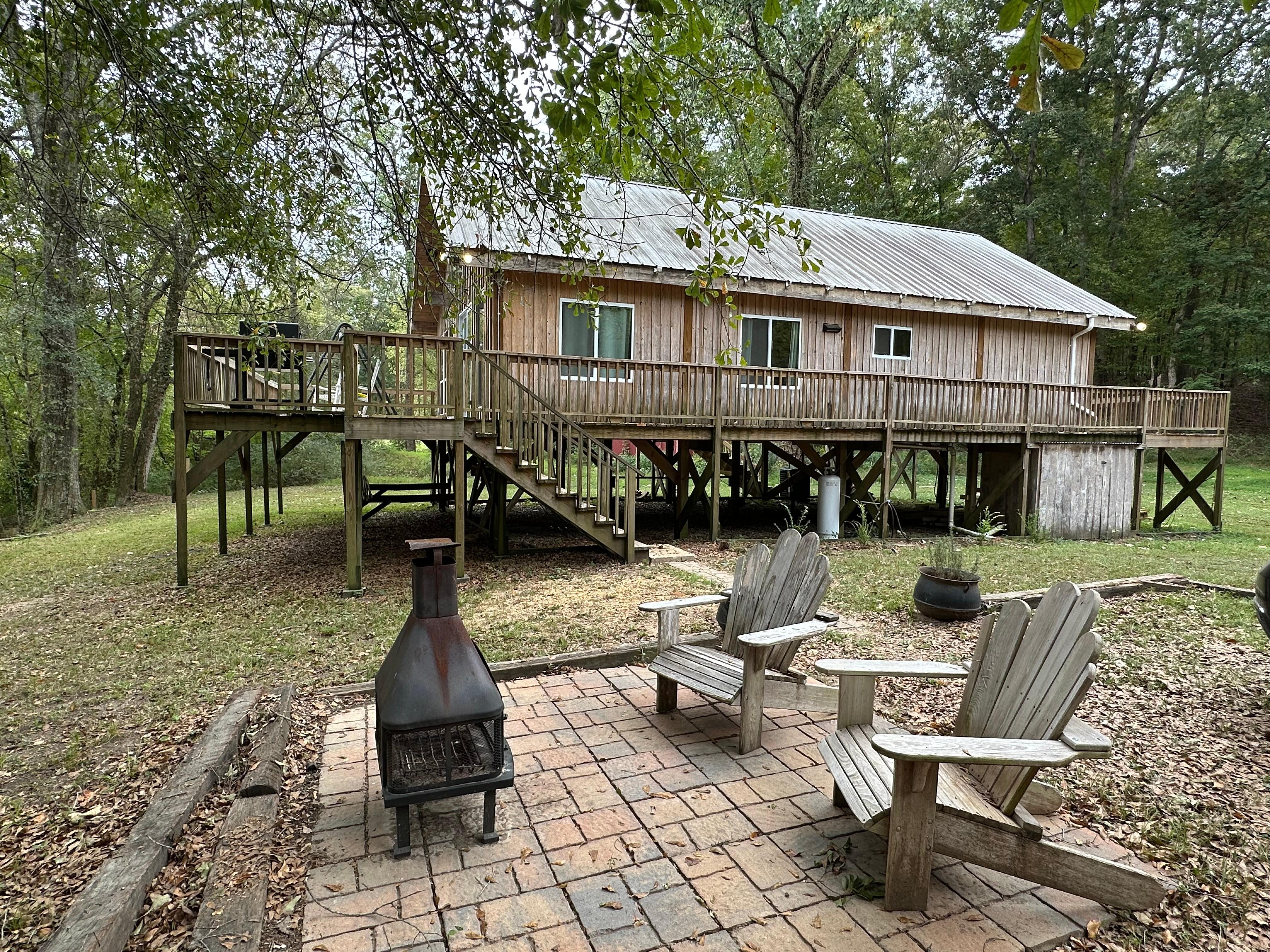 You park to the right of the fire pit. Hare to walk up the stairs to enter the house. The keyed door isactually around the back side, FYI.. 