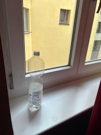 empty water bottles in several spots around the apartment