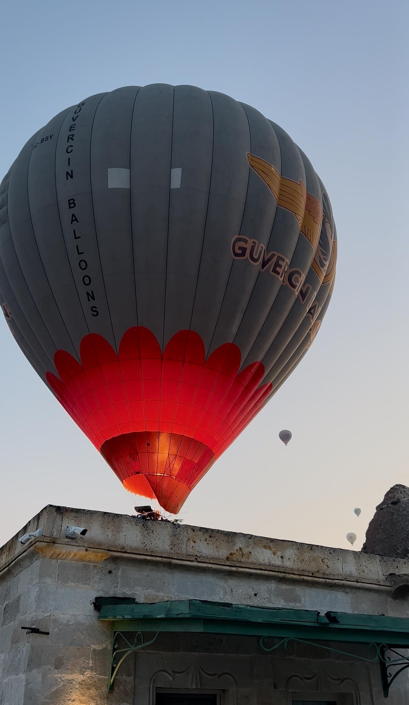 Hot air balloon passing over the hotel