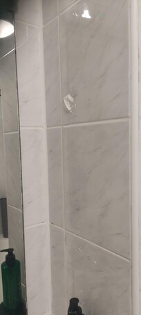 Something attached to the tiles, turned out to be dried on tissue