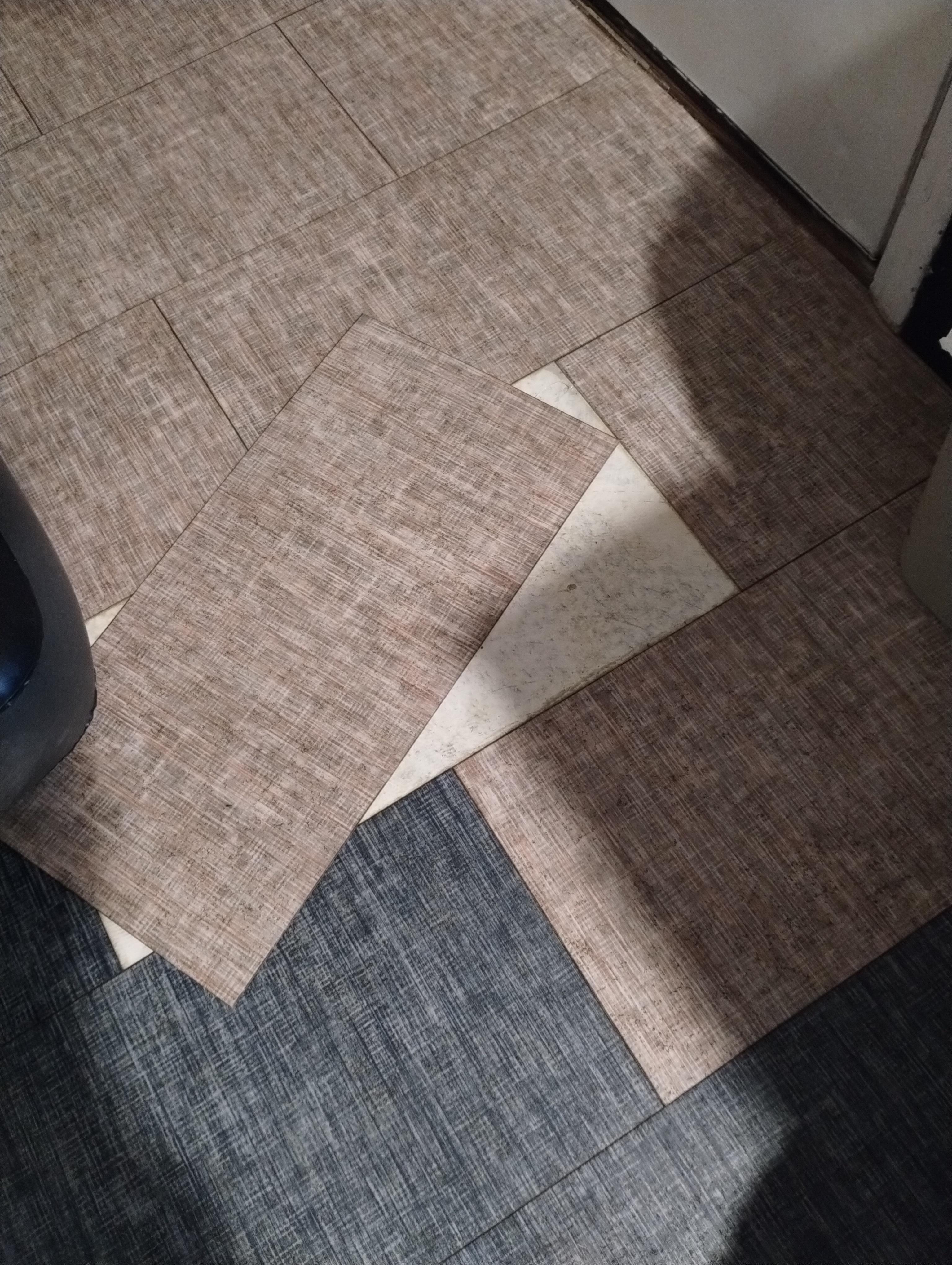 Floor tiles loose and moving