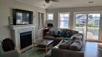 A delightfully cozy den to curl up on the couches and enjoy some good food and fun movies like "Cars" and "Jumanji"!