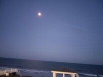 Full moon over the ocean.