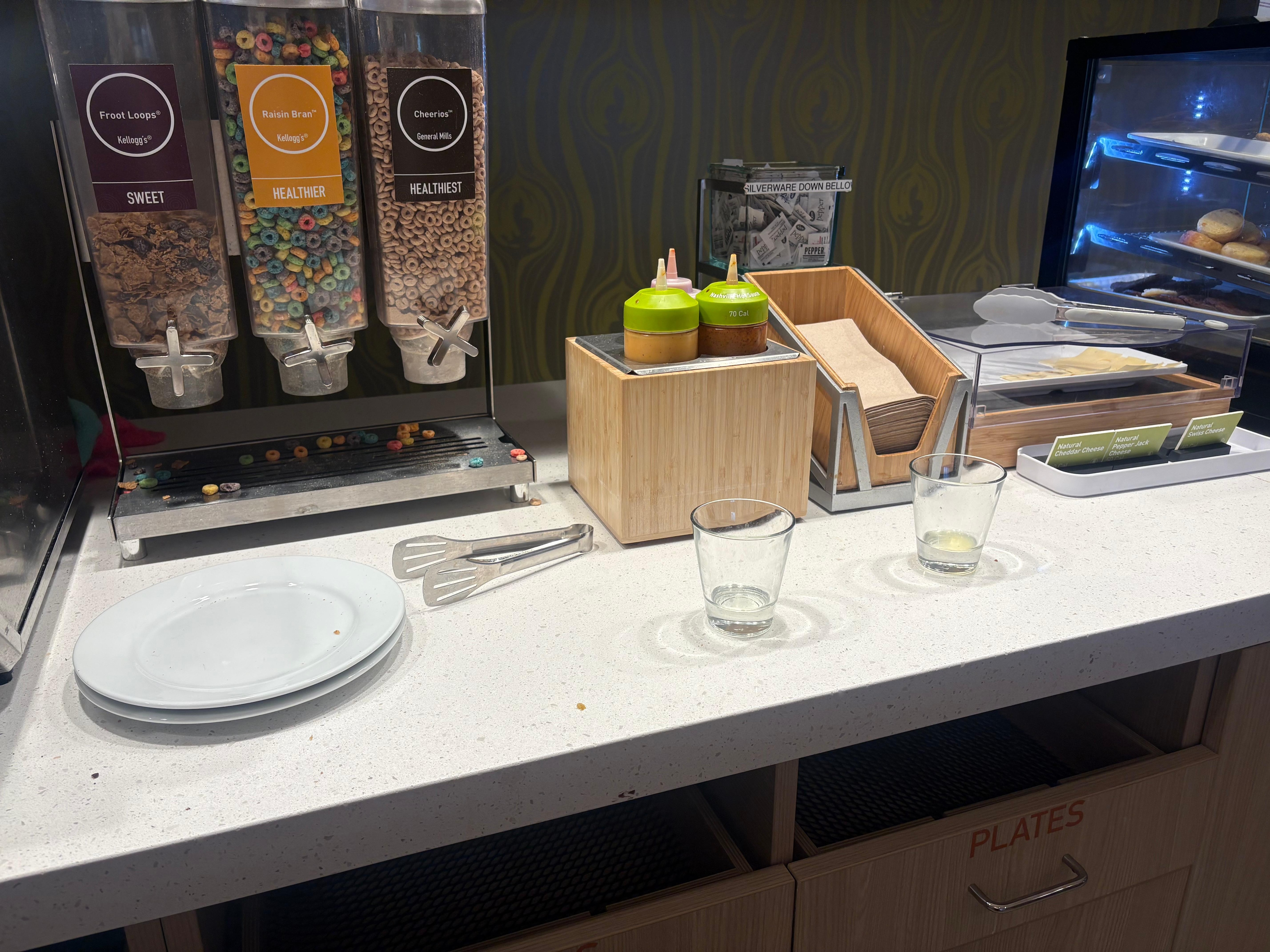 Dirty dishes left on the breakfast counter. 