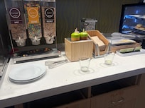 Dirty dishes left on the breakfast counter.