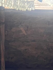 nails hanging out of roof