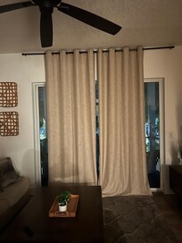 Curtains do not cover the whole window so people on river walk can see in.