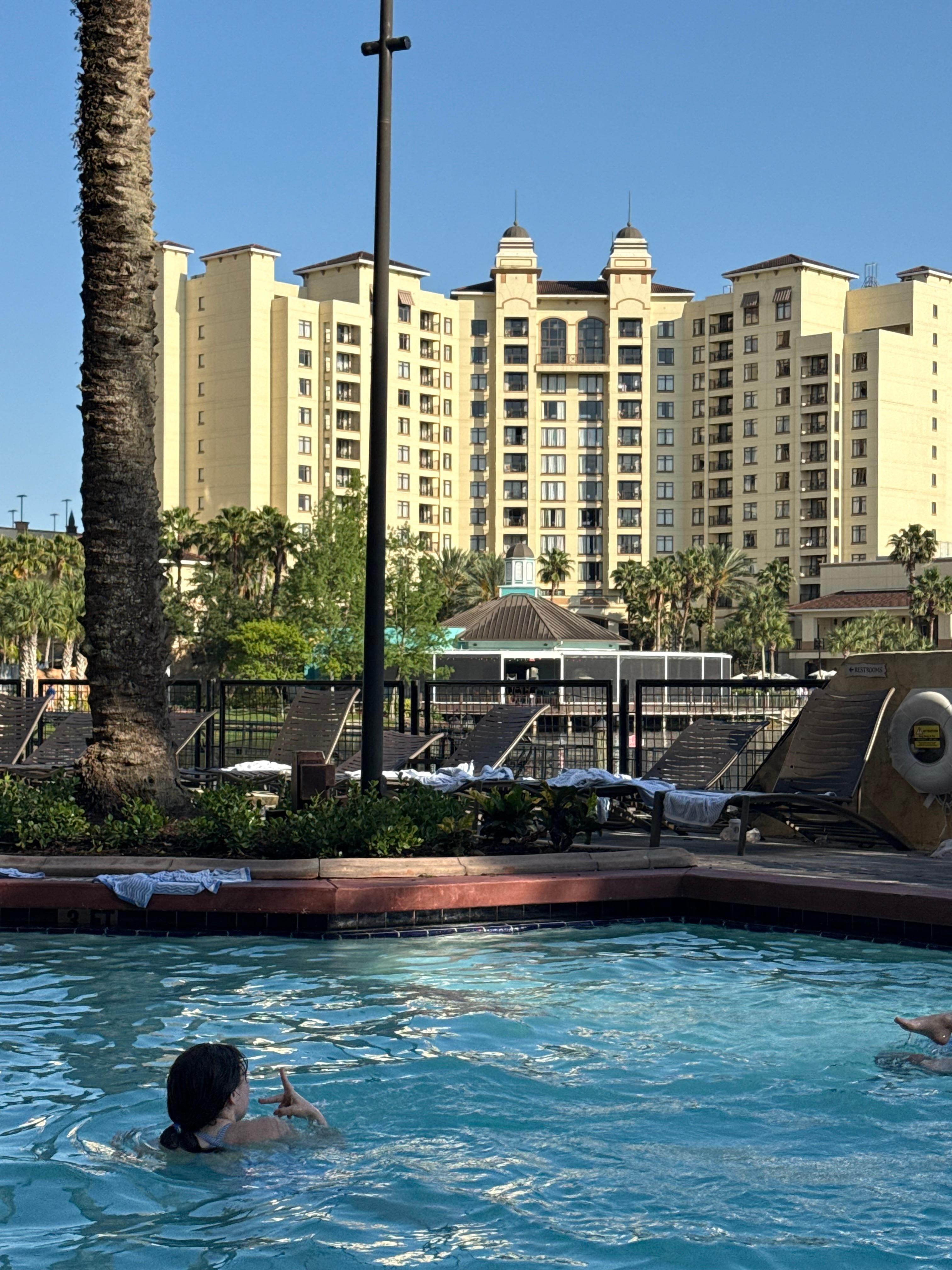 One of the pools and one of the buildings on property across the way