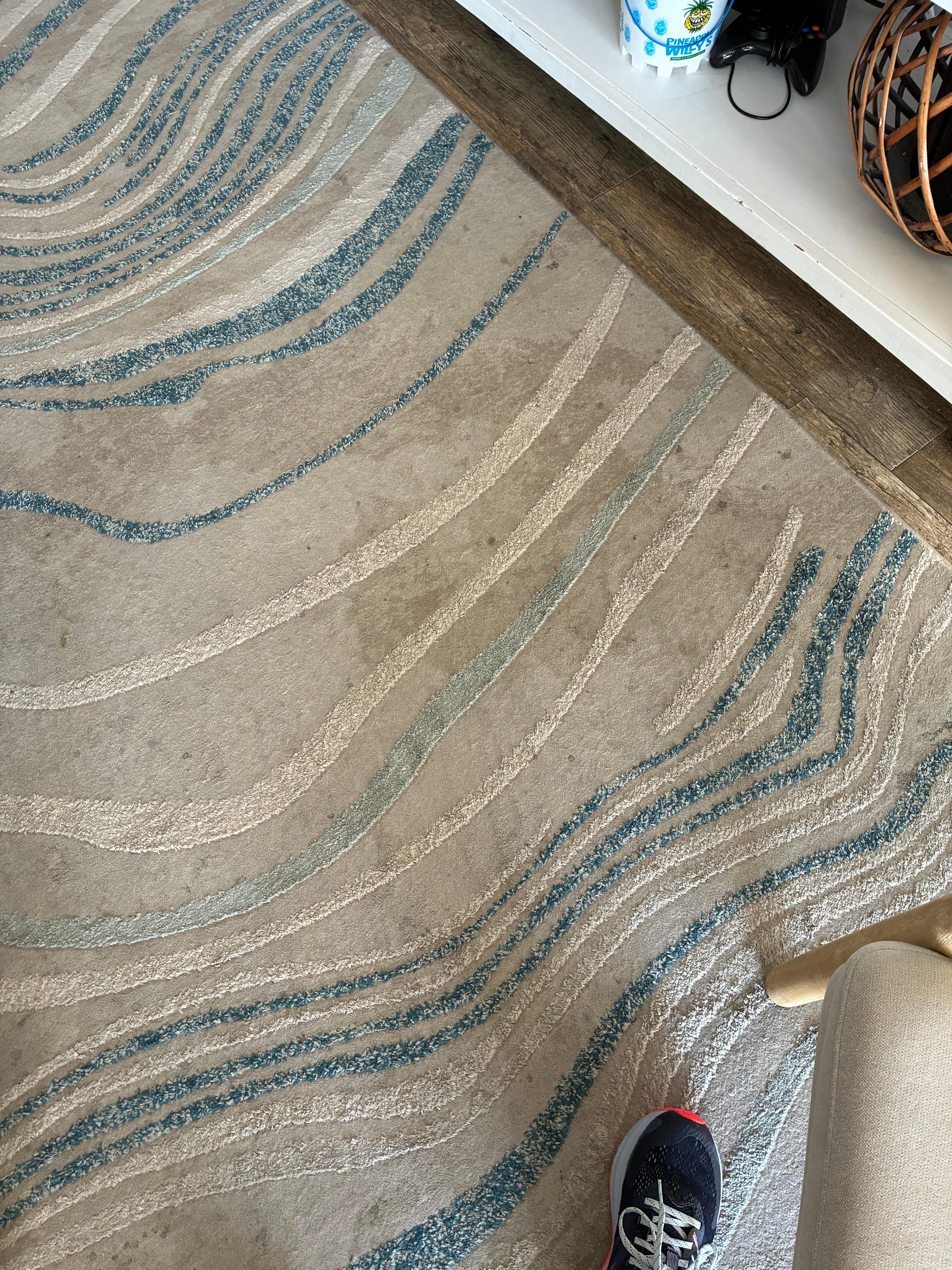 Filthy area rug. Badly stained 