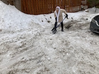 The owner shoveling