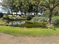 Pond to side of bouse