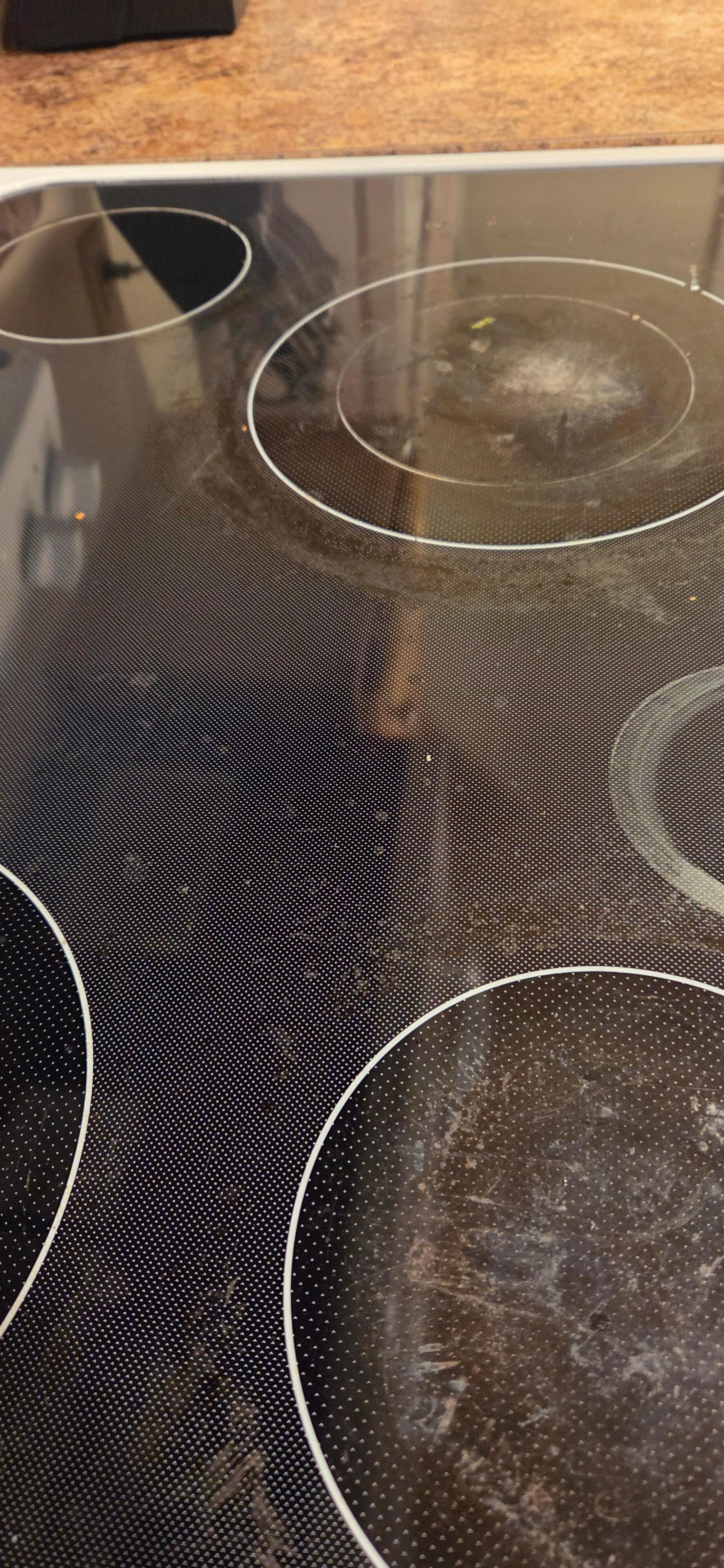 Dirty stovetop with stuck on food. 