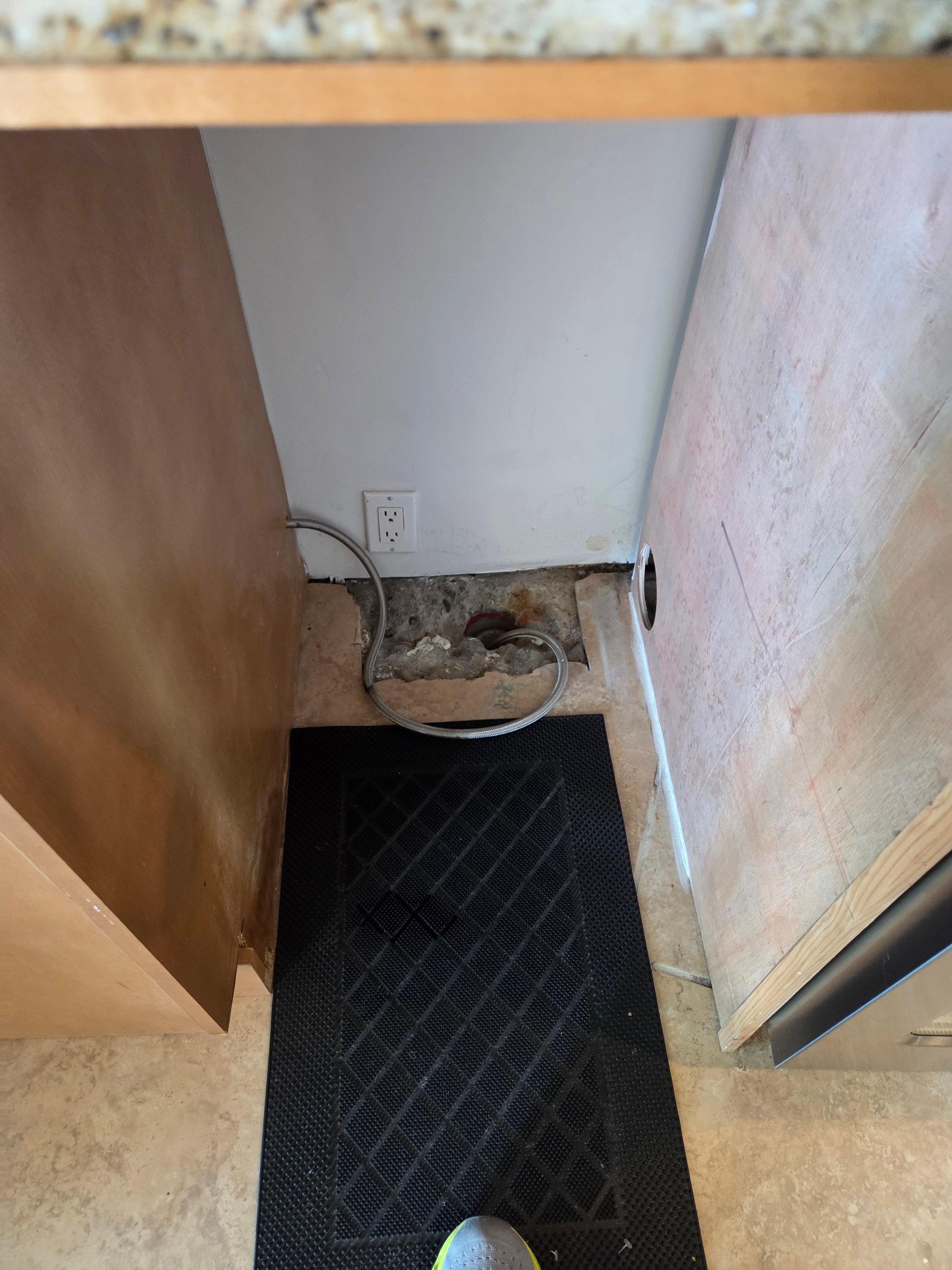 Location where ice maker was.  Covered with a $5 door mat.