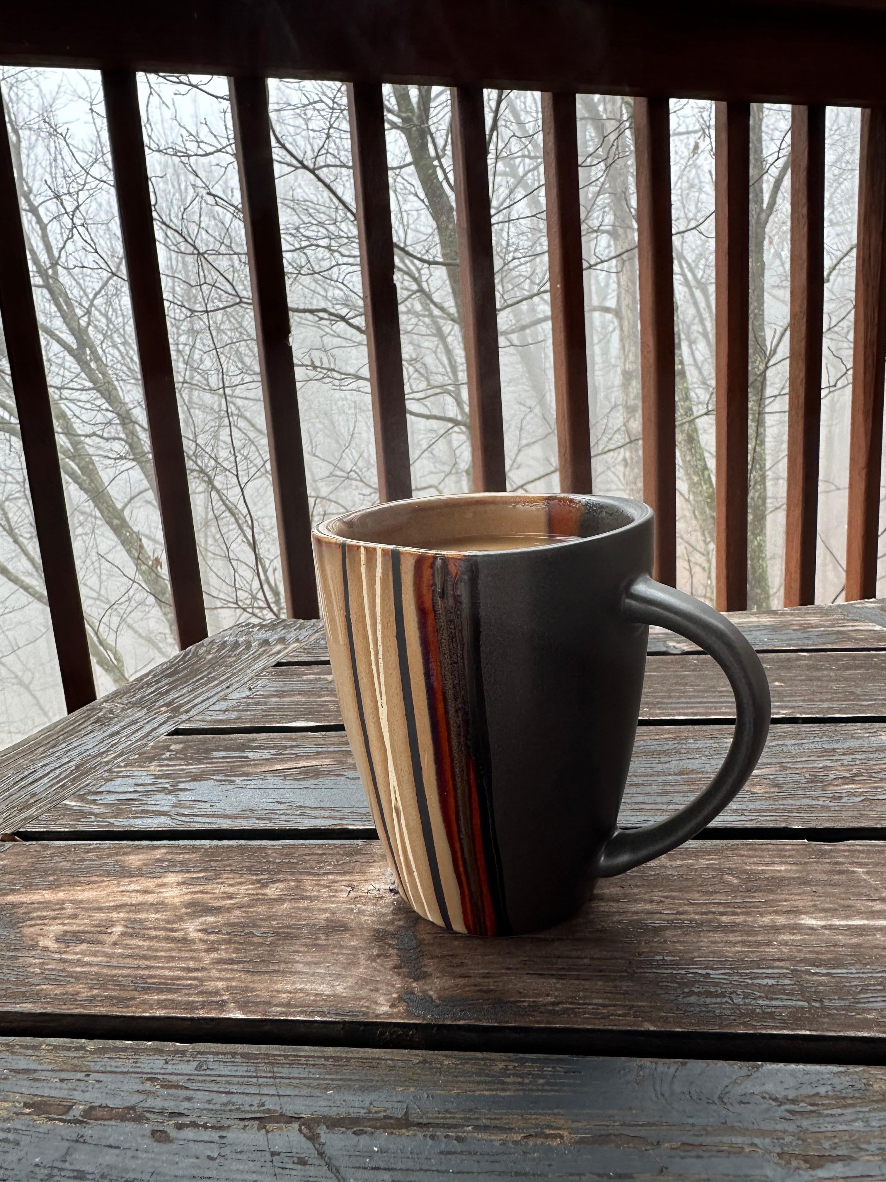 Morning coffee on the deck up in the trees and fog. Very relaxing!