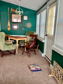 Game room/Sunroom and there are a ton of family friendly board games/puzzles