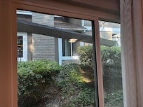 Broken rain gutter visible from living room window